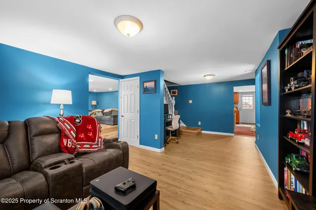 a projector room with furniture and a book shelf