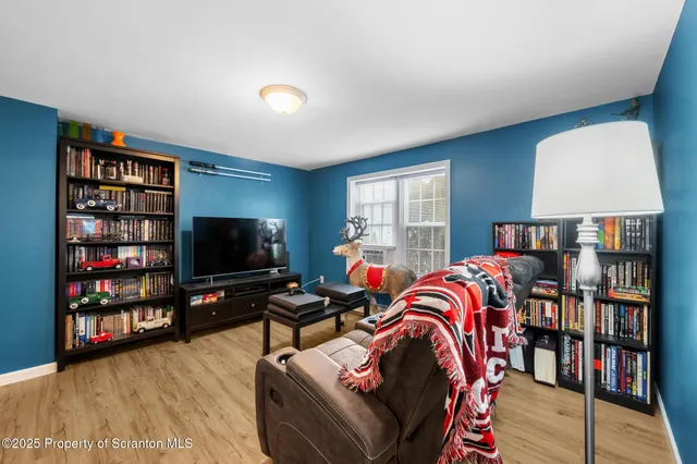 a living room with lots of furniture and a flat screen tv