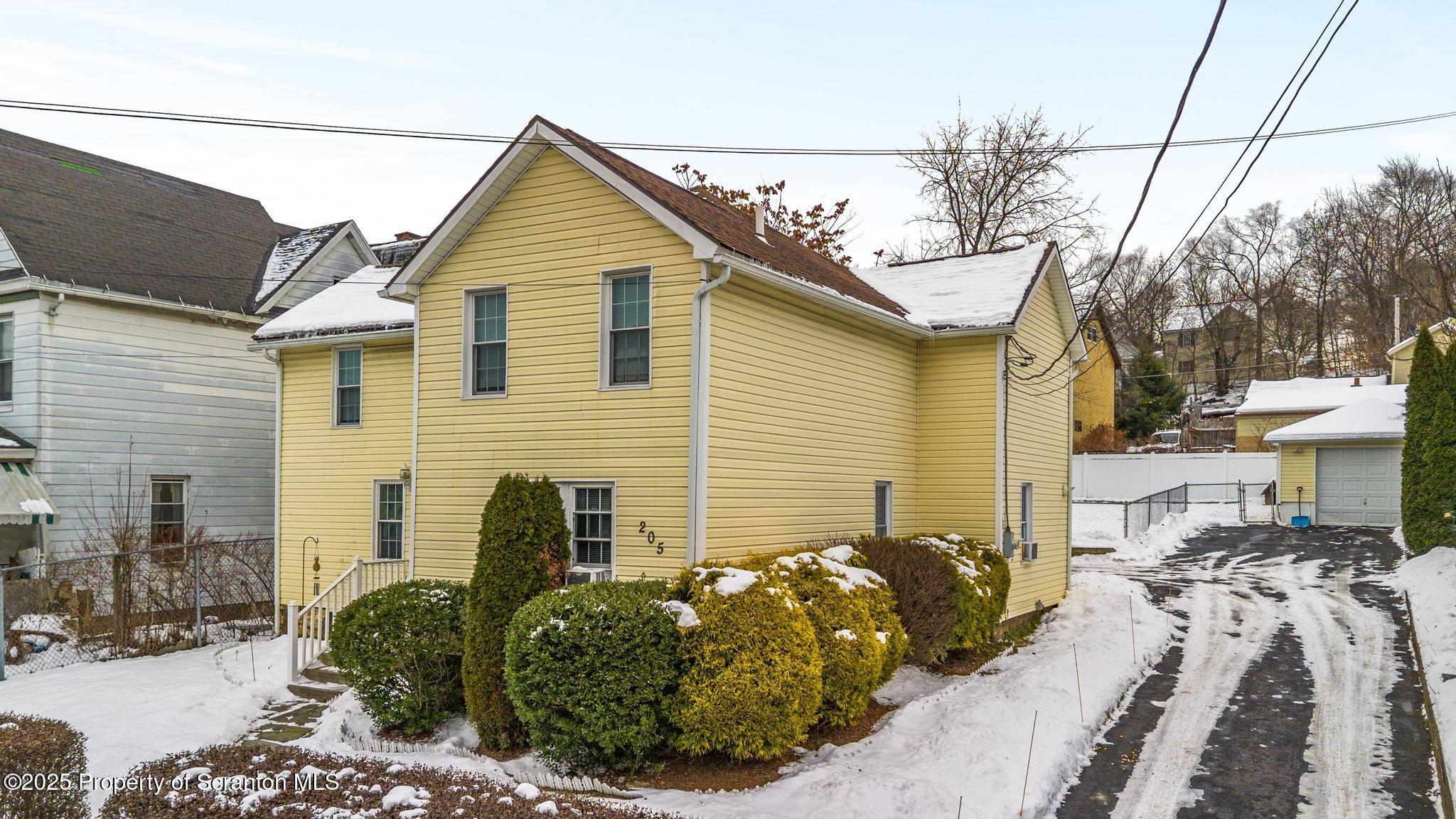 205 South Valley Avenue Olyphant, PA 18447 - Photo 43 of 44 a front view of a house with a yard