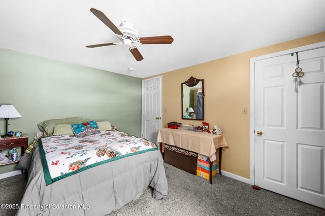 a room that has a bed and a dresser in it