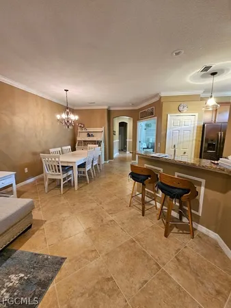 a living room with couches and painting on the wall