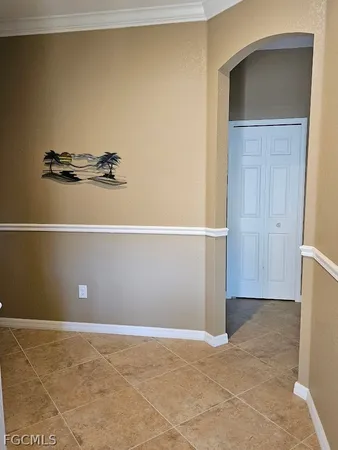 a view of room with walk in closet and wooden floor