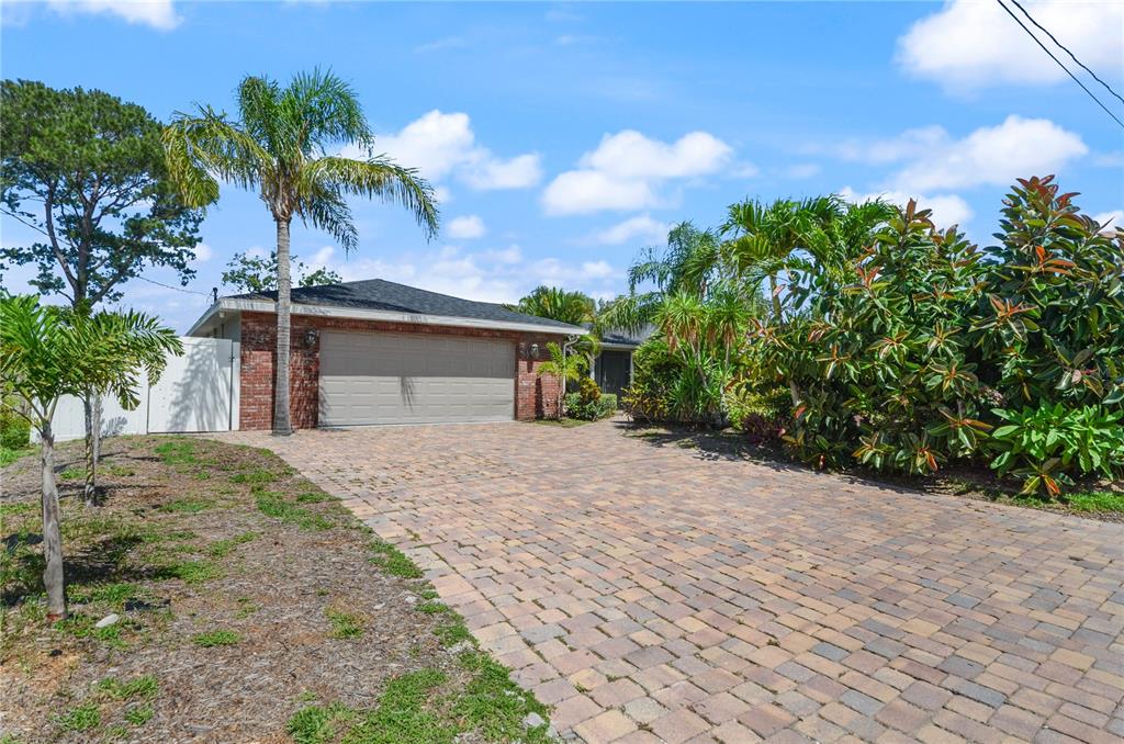 209 7th Street South Dundee, FL 33838 - Photo 2 of 36 a front view of a house with a yard and a garage