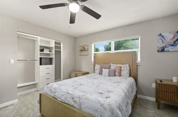 a bed room with a bed and a window