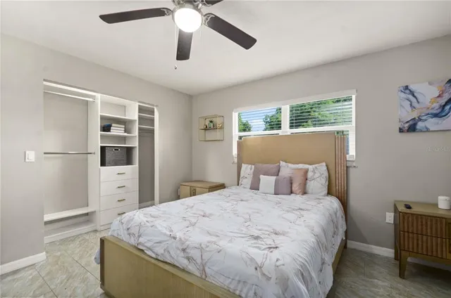 a bed room with a bed and a window