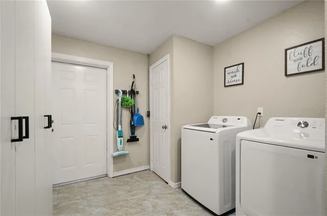 a view of utility room with washer and dryer