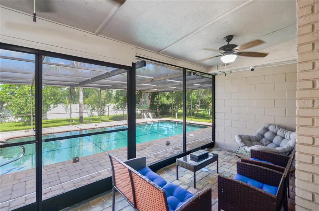 209 7th Street South Dundee, FL 33838 - Photo 28 of 36 a living room with furniture and a floor to ceiling window