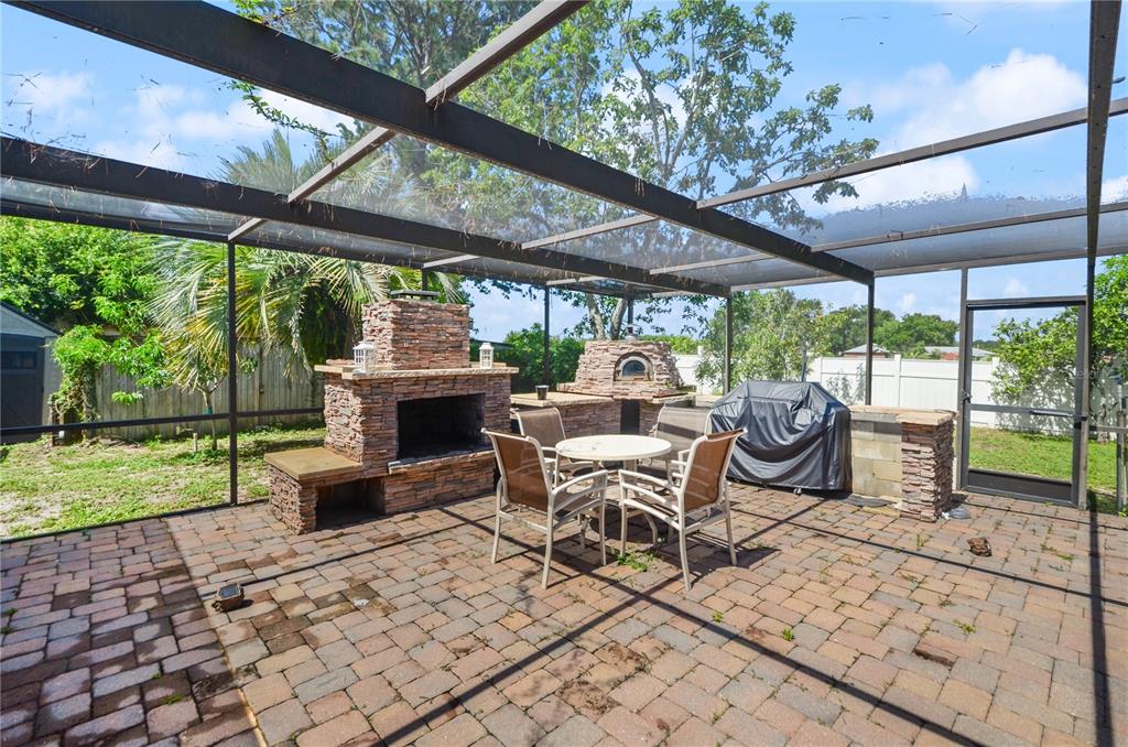209 7th Street South Dundee, FL 33838 - Photo 30 of 36 a view of a patio with a table chairs and a backyard