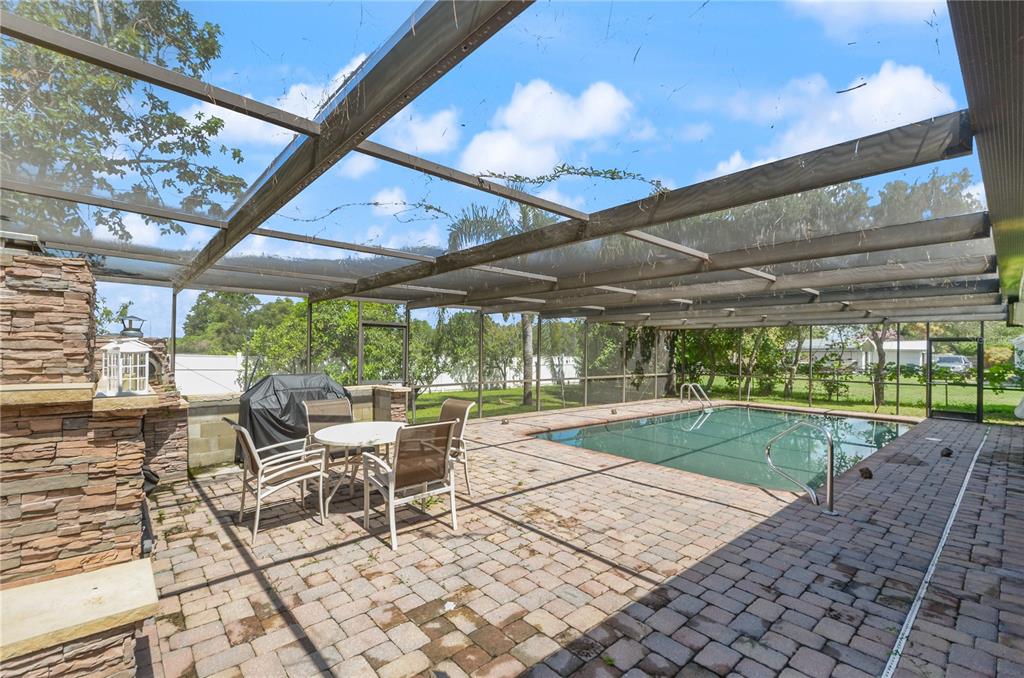 209 7th Street South Dundee, FL 33838 - Photo 31 of 36 a view of a porch with chairs and backyard
