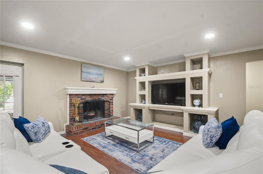 209 7th Street South Dundee, FL 33838 - Photo 8 of 36 a living room with furniture fireplace and flat screen tv