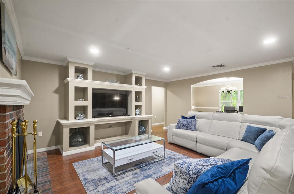209 7th Street South Dundee, FL 33838 - Photo 9 of 36 a living room with furniture and a flat screen tv