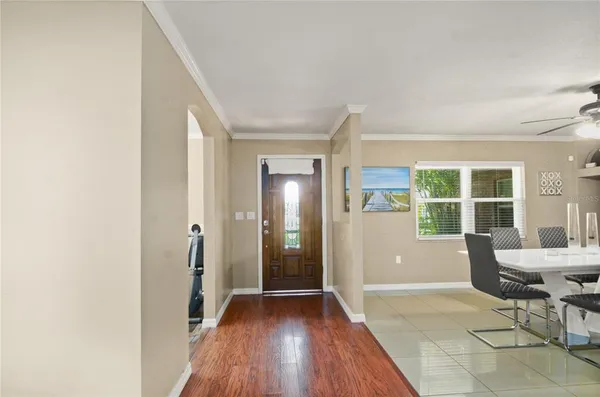 a view of a livingroom with wooden floor and furniture