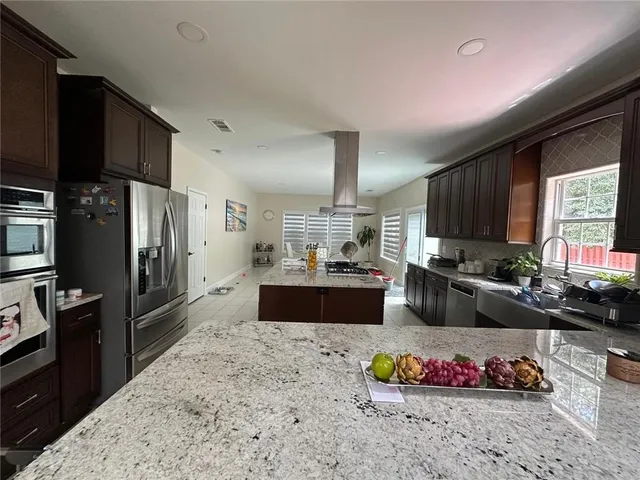 a kitchen with granite countertop lots of counter top space