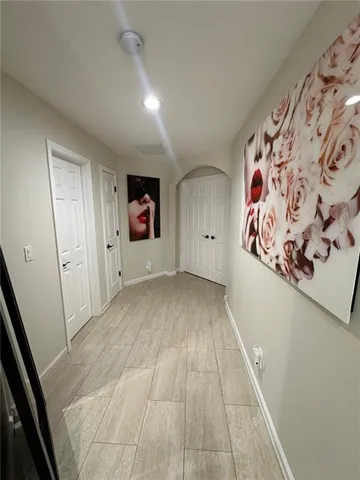 a view of a hallway with seating area