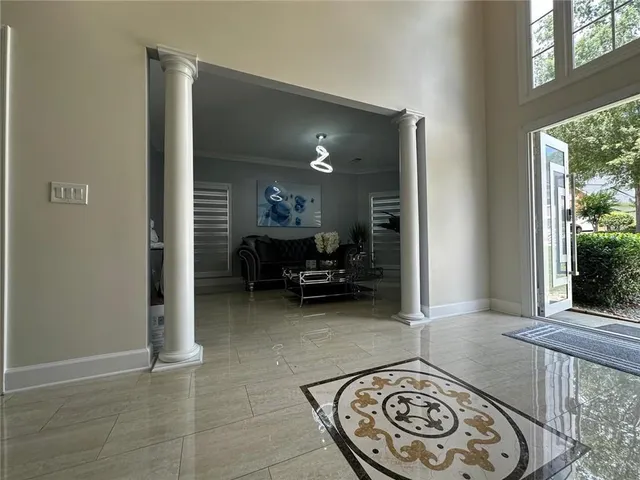 a living room with furniture a dining table and with window