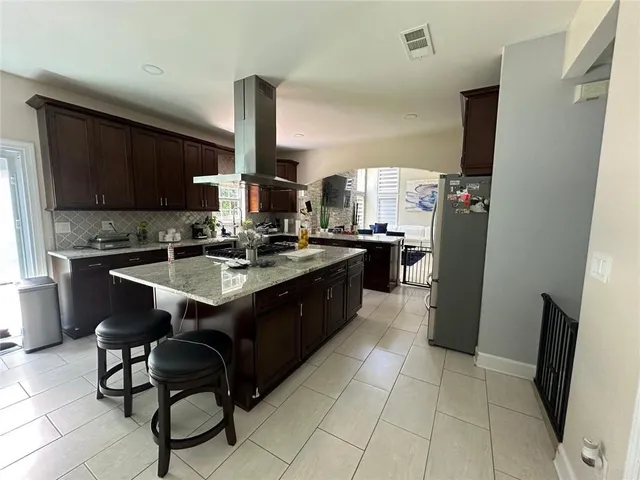 a kitchen with a sink appliances and cabinets