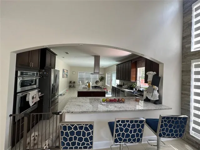 a kitchen with a refrigerator and a sink