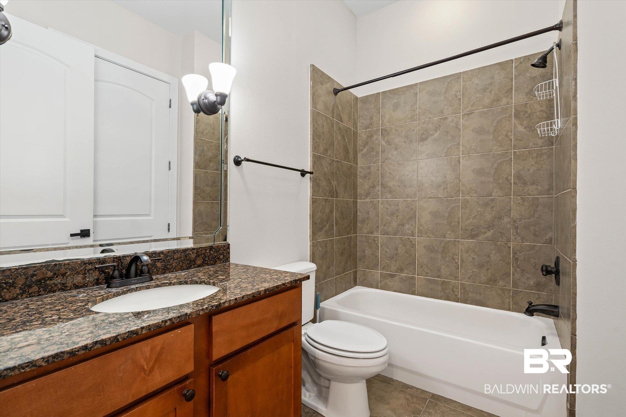 1430 Regency Road, Unit C202 Gulf Shores, AL 36542 - Photo 17 of 27 Tiled bath with tub/shower combo