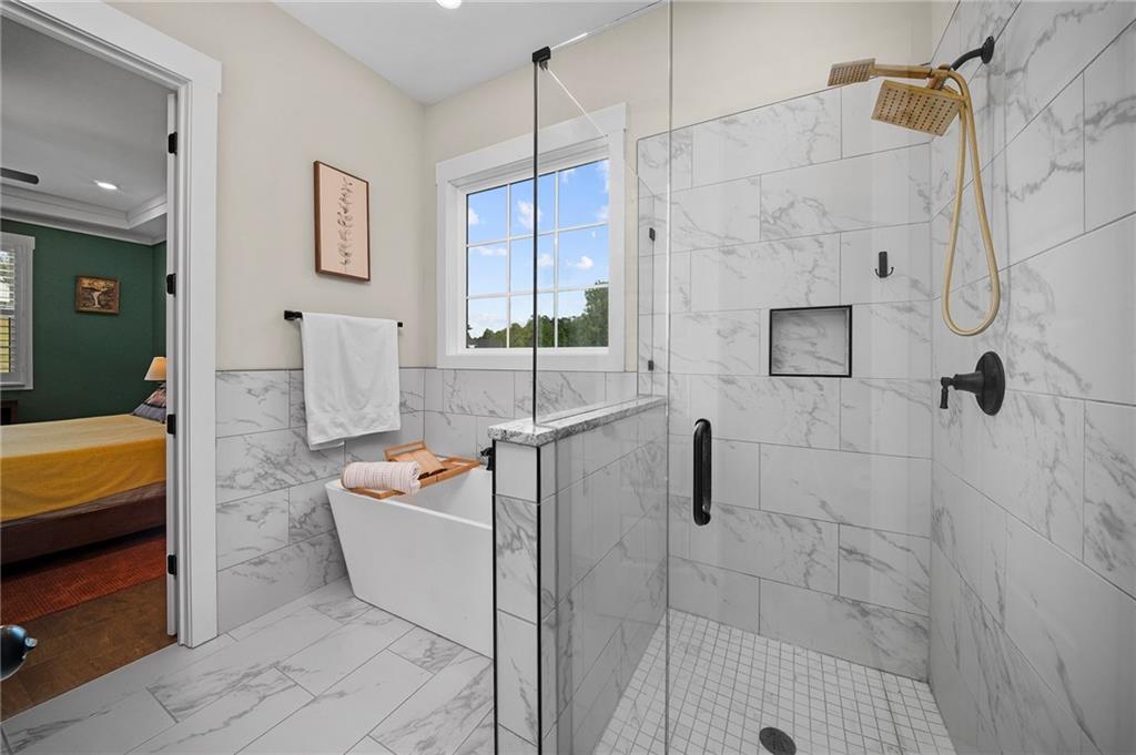 392 London Road Ball Ground, GA 30107 - Photo 17 of 53 a bathroom with a sink a bath tub and shower