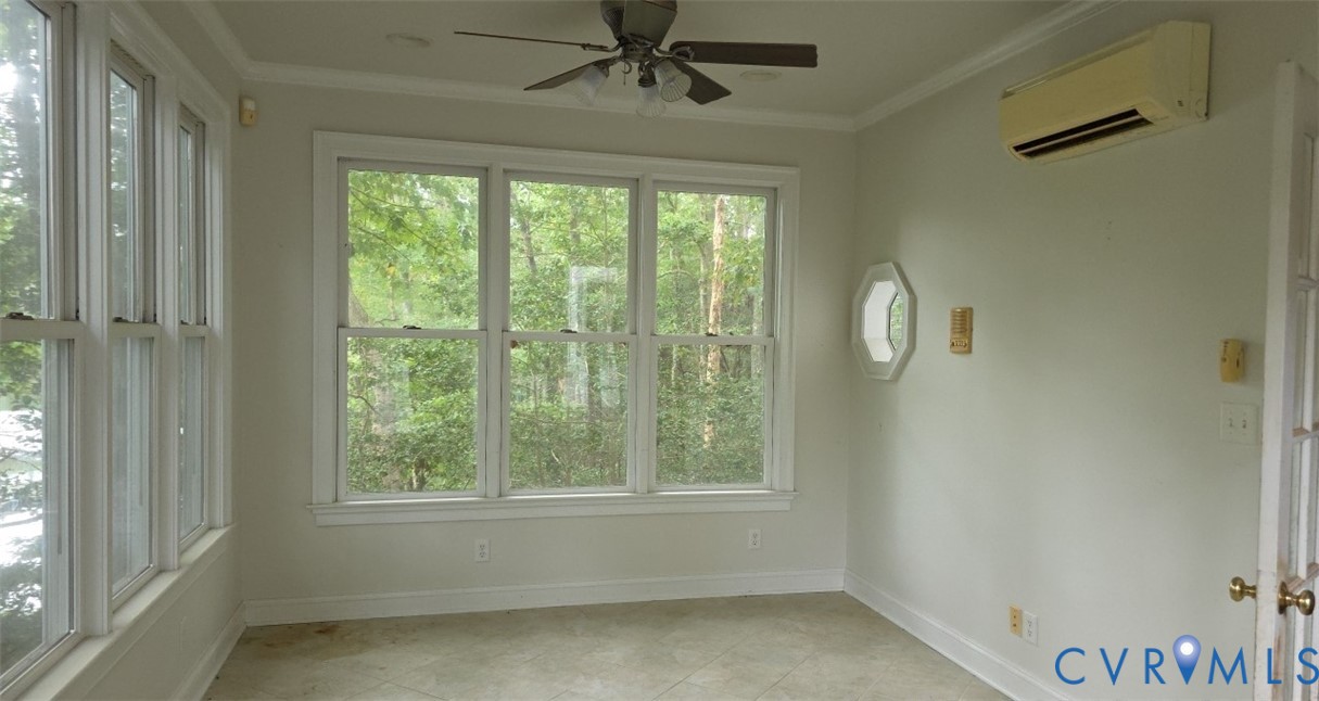 235 Oak Point Drive Lancaster, VA 22503 - Photo 11 of 12 Empty room with a wall mounted air conditioner, or