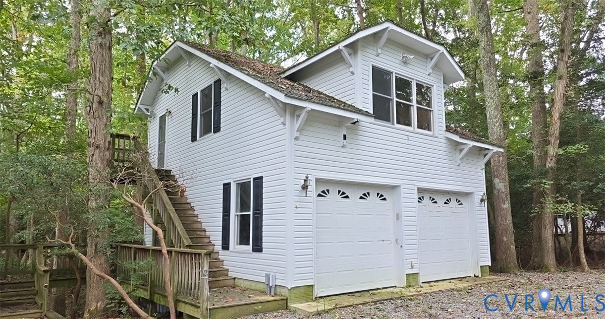 235 Oak Point Drive Lancaster, VA 22503 - Photo 12 of 12 View of side of property featuring a deck and an a