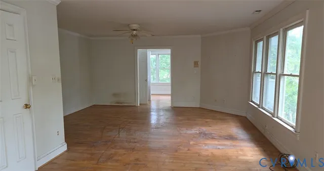 a view of an empty room with a window