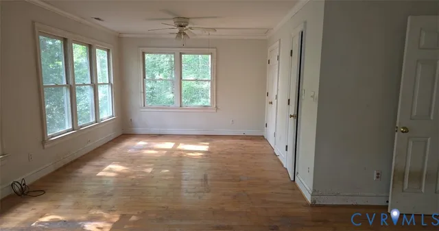 a view of empty room with windows