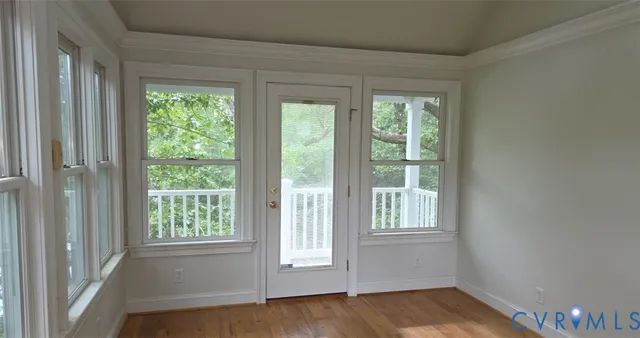 a view of a livingroom with a window and a ceiling fan