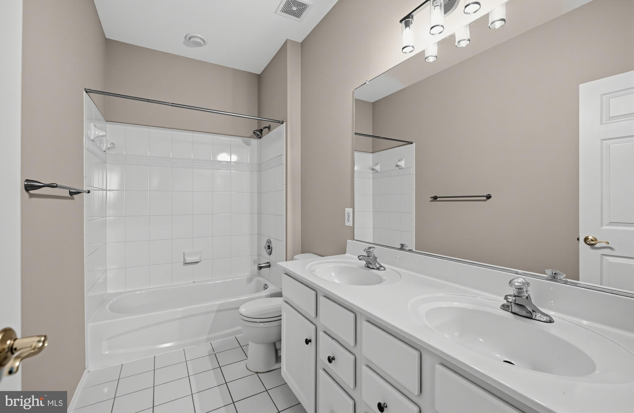 3938 Addison Woods Road Frederick, MD 21704 - Photo 28 of 39 Modern bathroom with dual sinks.