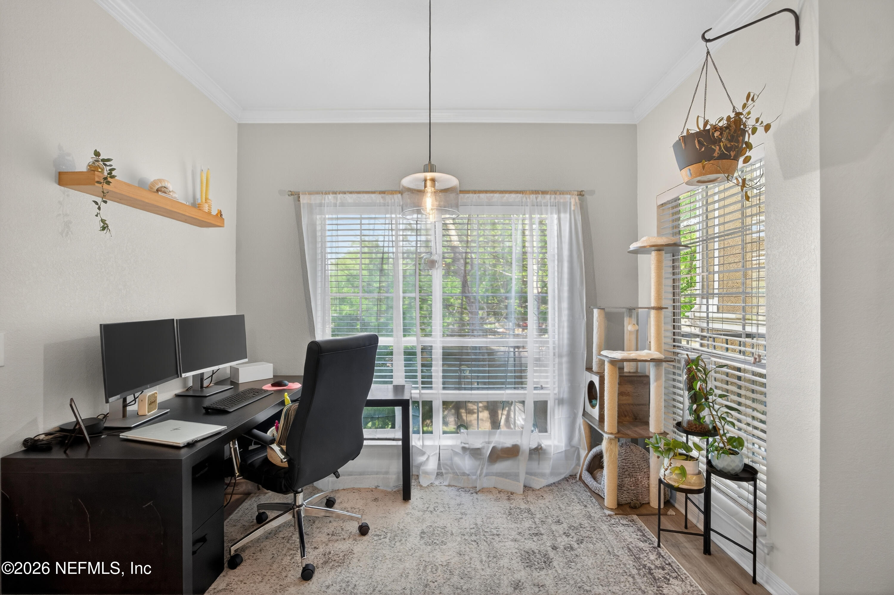 10961 Burnt Mill Road, Unit 1524 Jacksonville, FL 32256 - Photo 11 of 38 a view of a workspace with furniture and a window