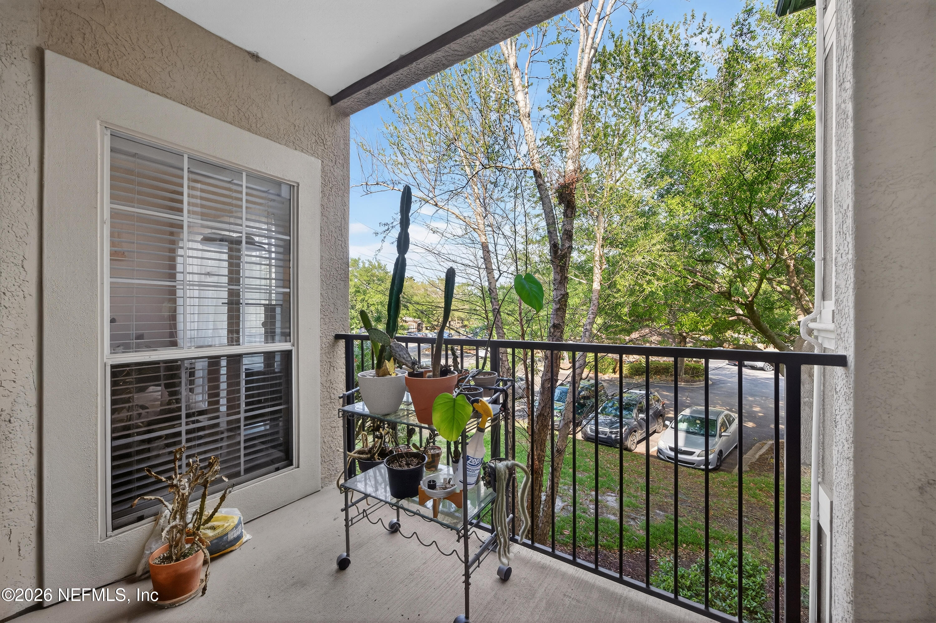 10961 Burnt Mill Road, Unit 1524 Jacksonville, FL 32256 - Photo 20 of 38 a view of a balcony with chairs