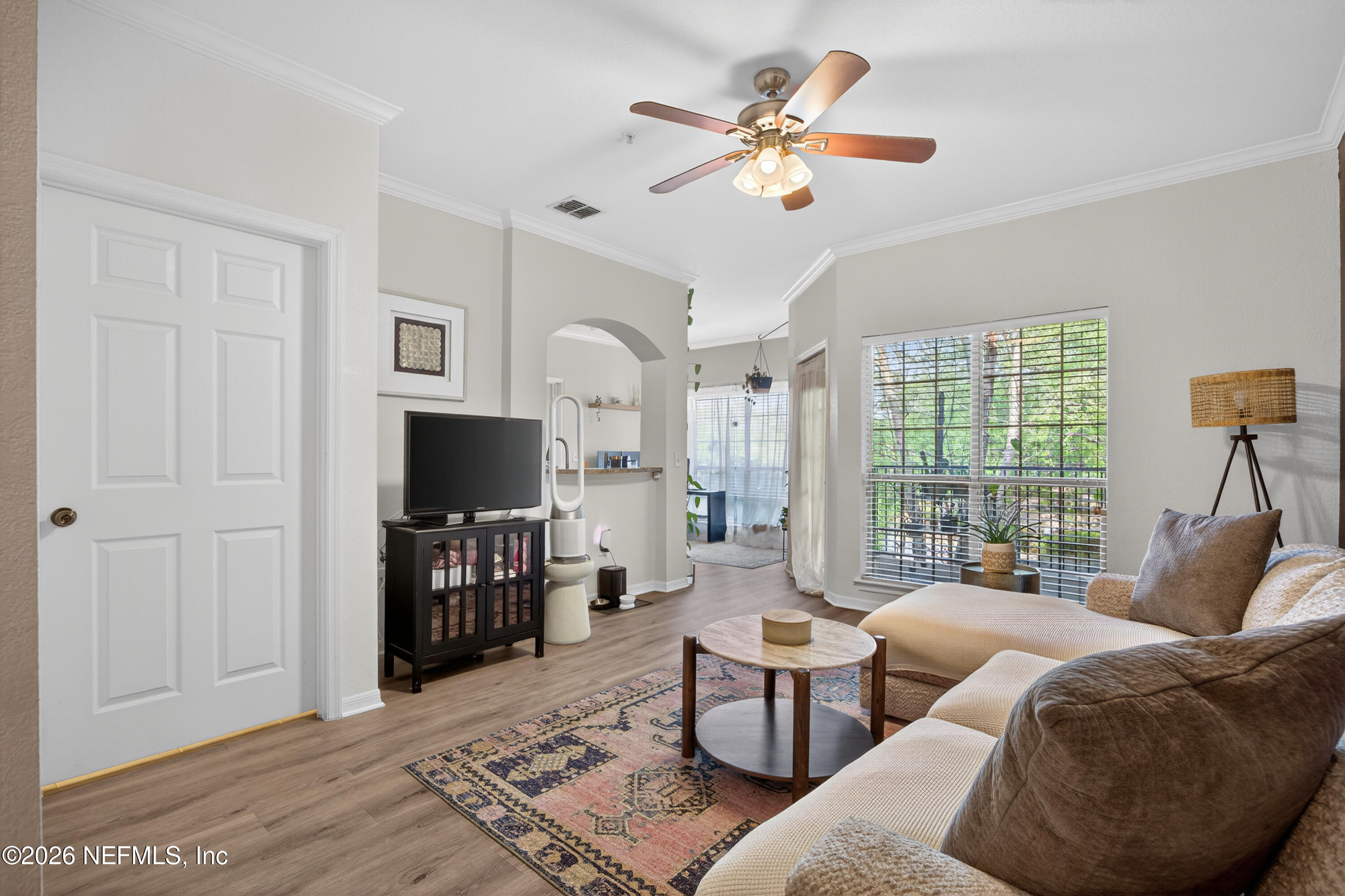 10961 Burnt Mill Road, Unit 1524 Jacksonville, FL 32256 - Photo 2 of 38 a living room with furniture and a flat screen tv