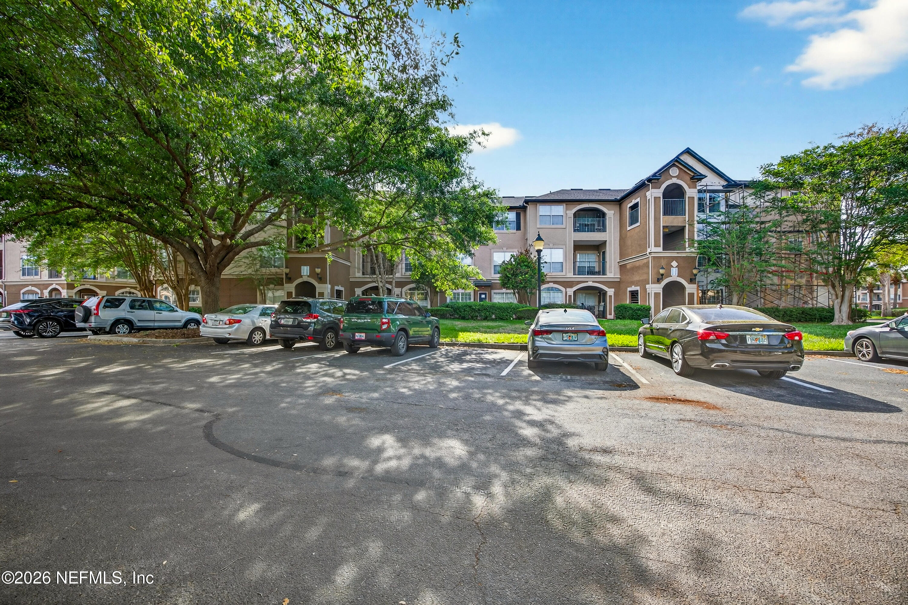 10961 Burnt Mill Road, Unit 1524 Jacksonville, FL 32256 - Photo 23 of 38 a car parked in front of house
