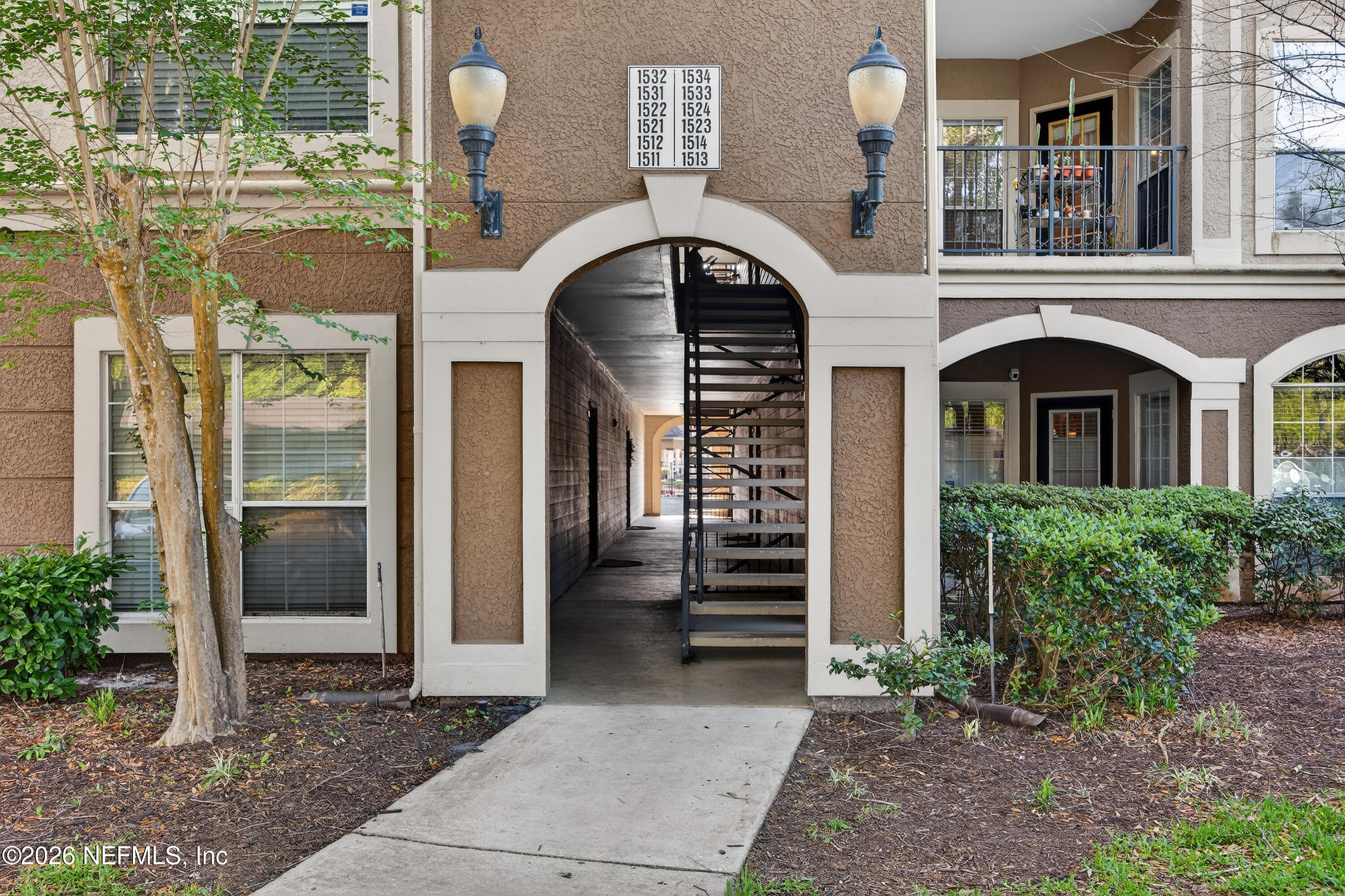 10961 Burnt Mill Road, Unit 1524 Jacksonville, FL 32256 - Photo 3 of 38 a building with a outdoor space