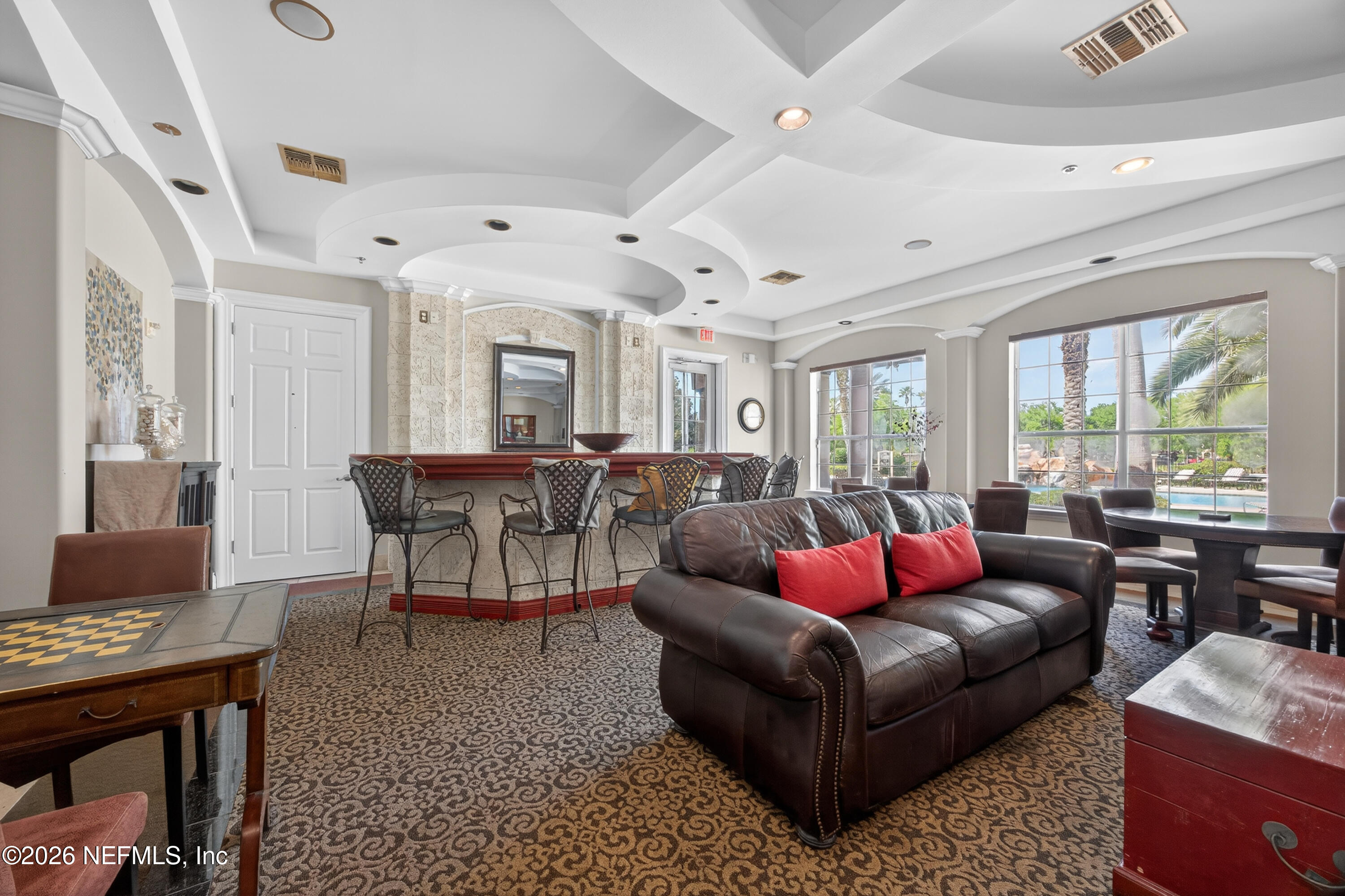 10961 Burnt Mill Road, Unit 1524 Jacksonville, FL 32256 - Photo 31 of 38 a living room with furniture ceiling fan and a window