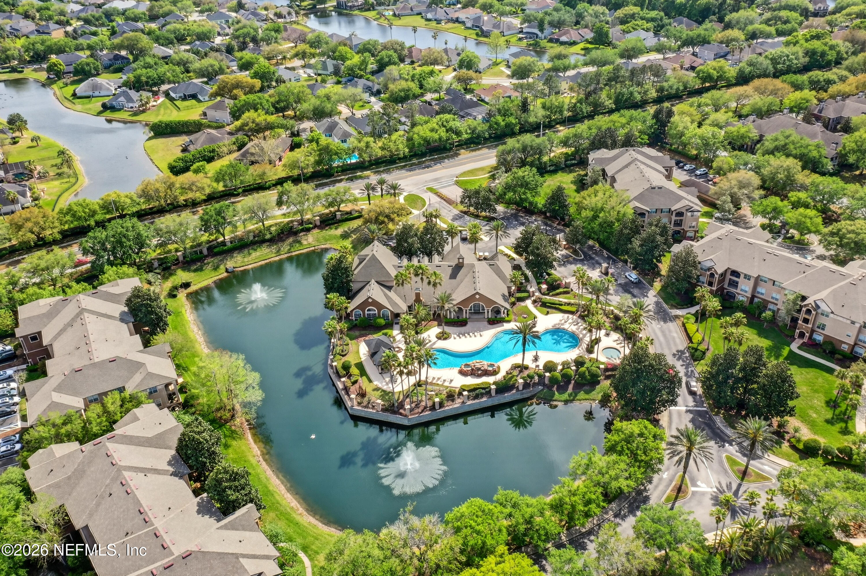 10961 Burnt Mill Road, Unit 1524 Jacksonville, FL 32256 - Photo 35 of 38 an aerial view of a house with a yard and lake view