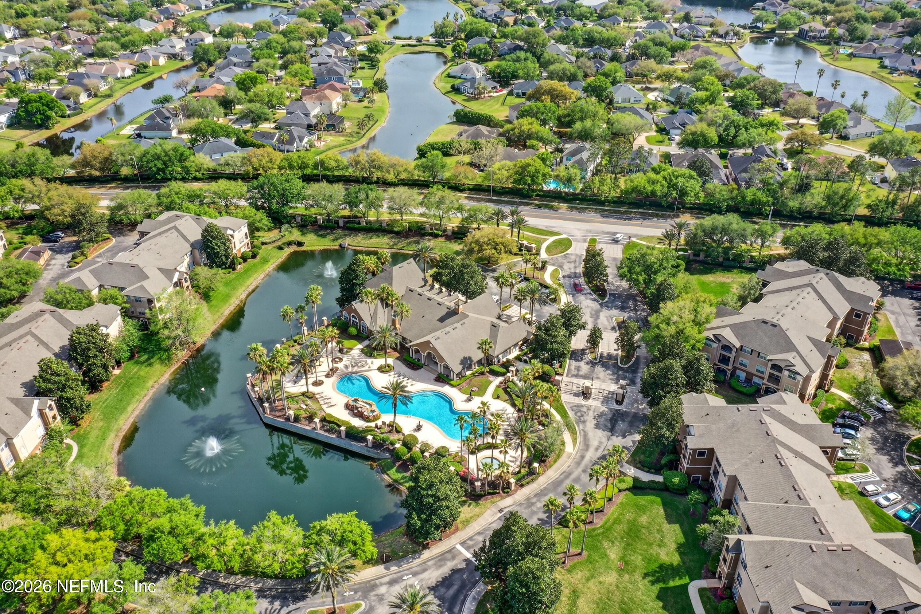 10961 Burnt Mill Road, Unit 1524 Jacksonville, FL 32256 - Photo 36 of 38 an aerial view of lake and residential houses with outdoor space