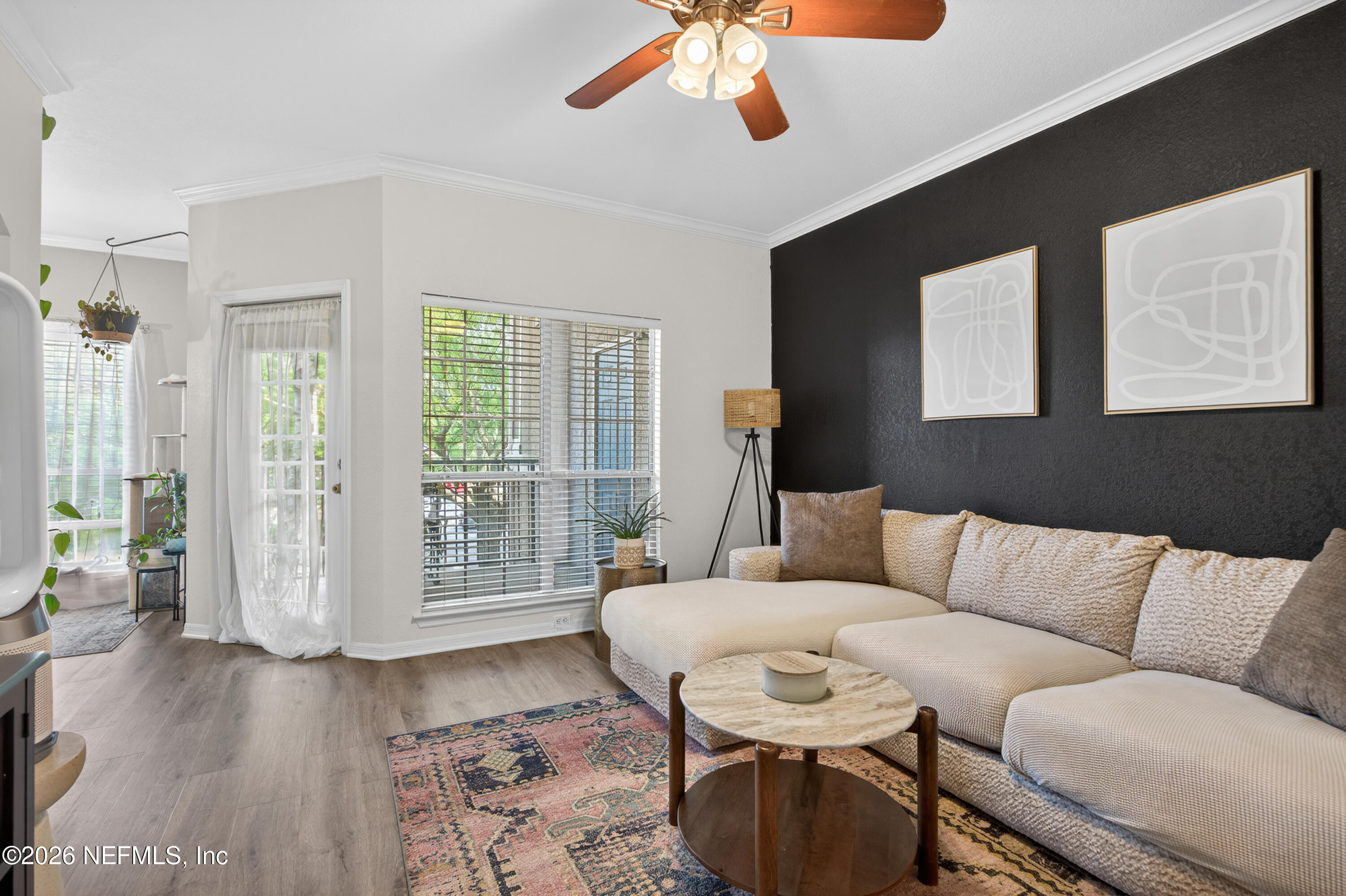 10961 Burnt Mill Road, Unit 1524 Jacksonville, FL 32256 - Photo 5 of 38 a living room with furniture and wooden floor