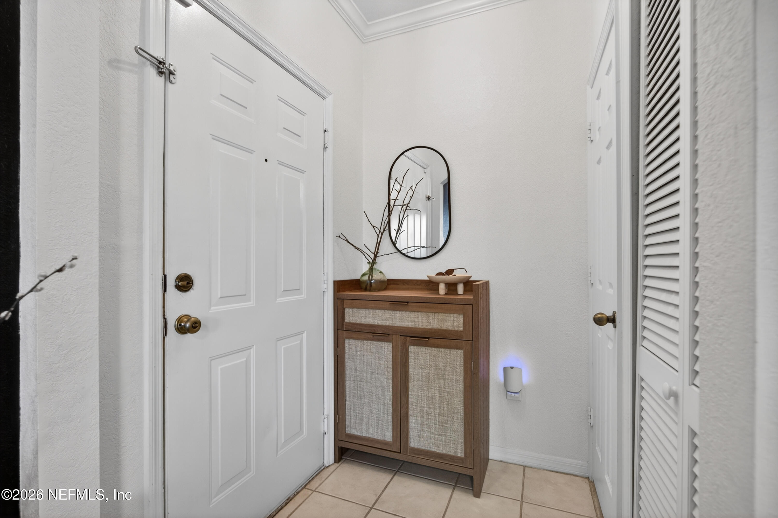 10961 Burnt Mill Road, Unit 1524 Jacksonville, FL 32256 - Photo 7 of 38 a bathroom with a mirror and a shower