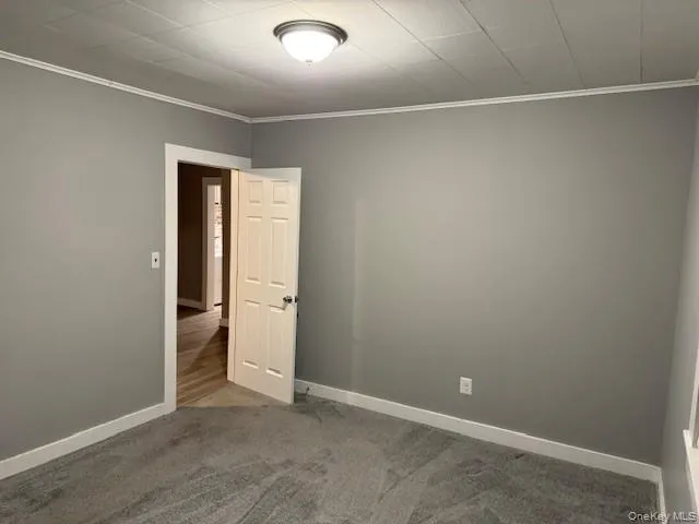 an empty room with a empty space and windows