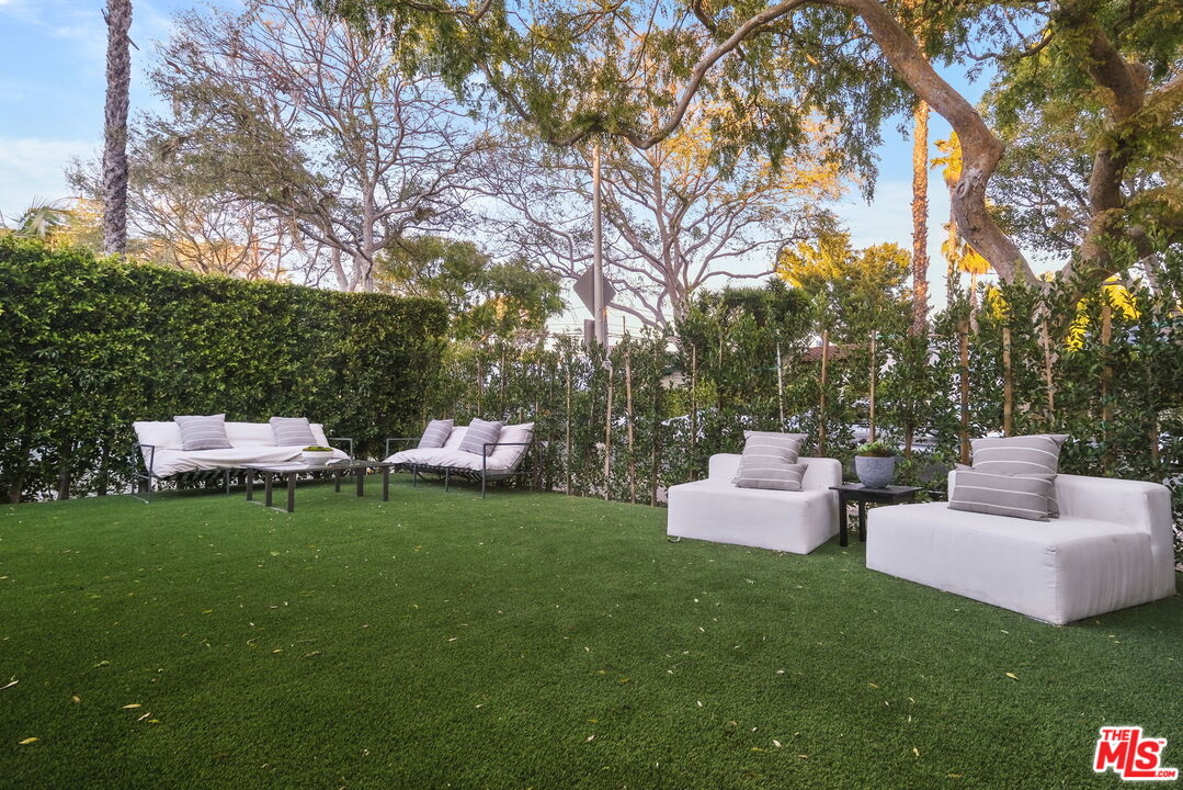 543 Westmount Drive West Hollywood, CA 90048 - Photo 2 of 44 a view of a patio with couches and a fire pit
