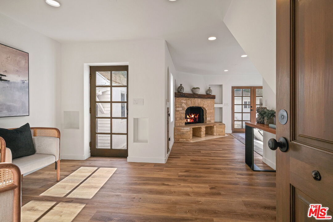 543 Westmount Drive West Hollywood, CA 90048 - Photo 13 of 44 a living room with furniture and a fireplace