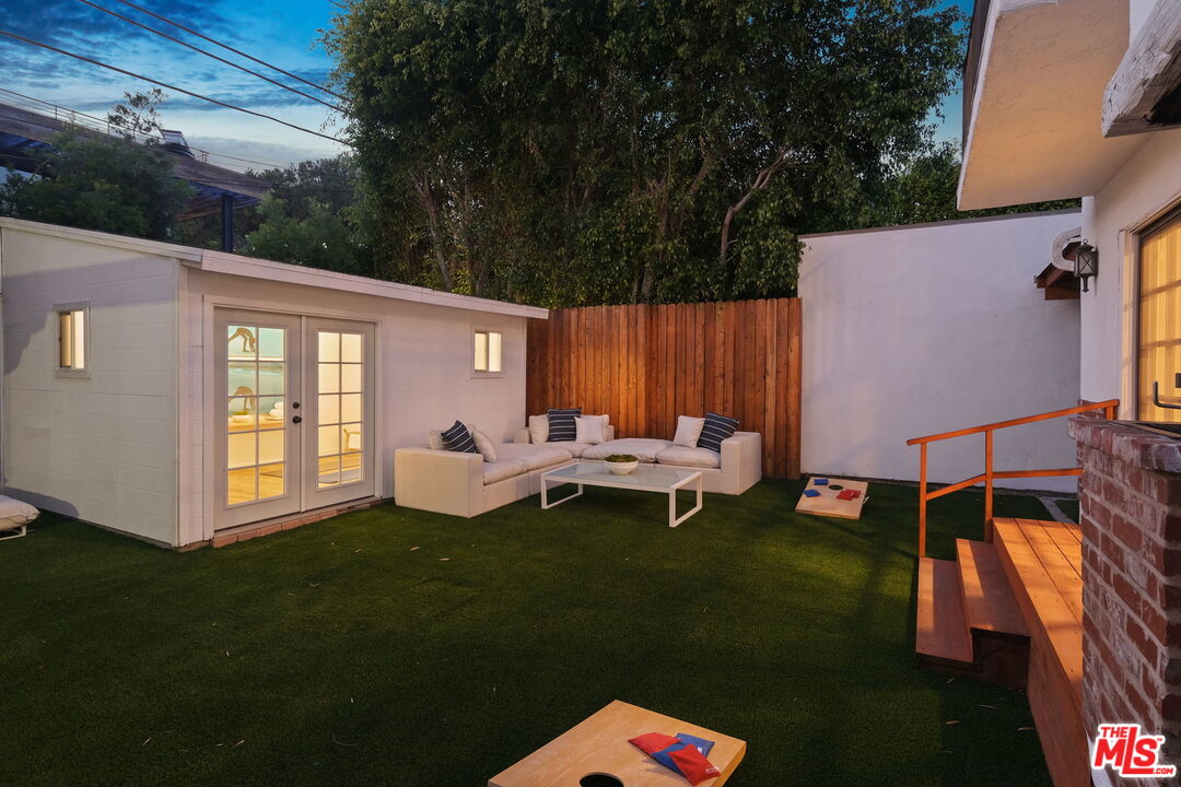 543 Westmount Drive West Hollywood, CA 90048 - Photo 40 of 44 a view of a two chairs in back yard of the house