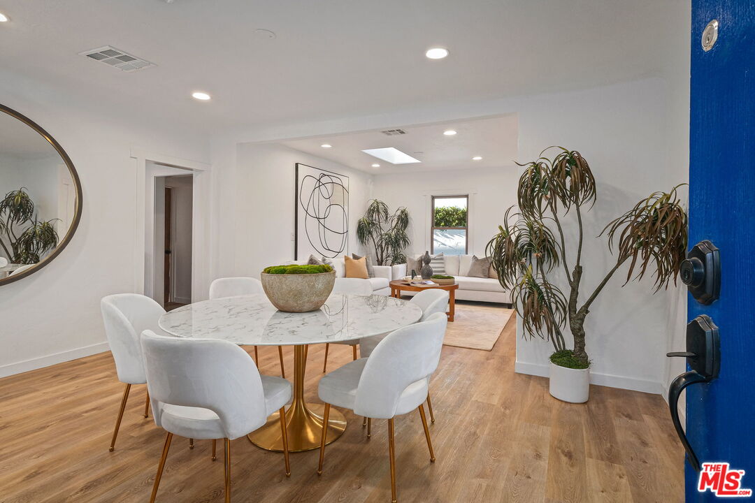543 Westmount Drive West Hollywood, CA 90048 - Photo 5 of 44 a view of a dining room with furniture and wooden floor