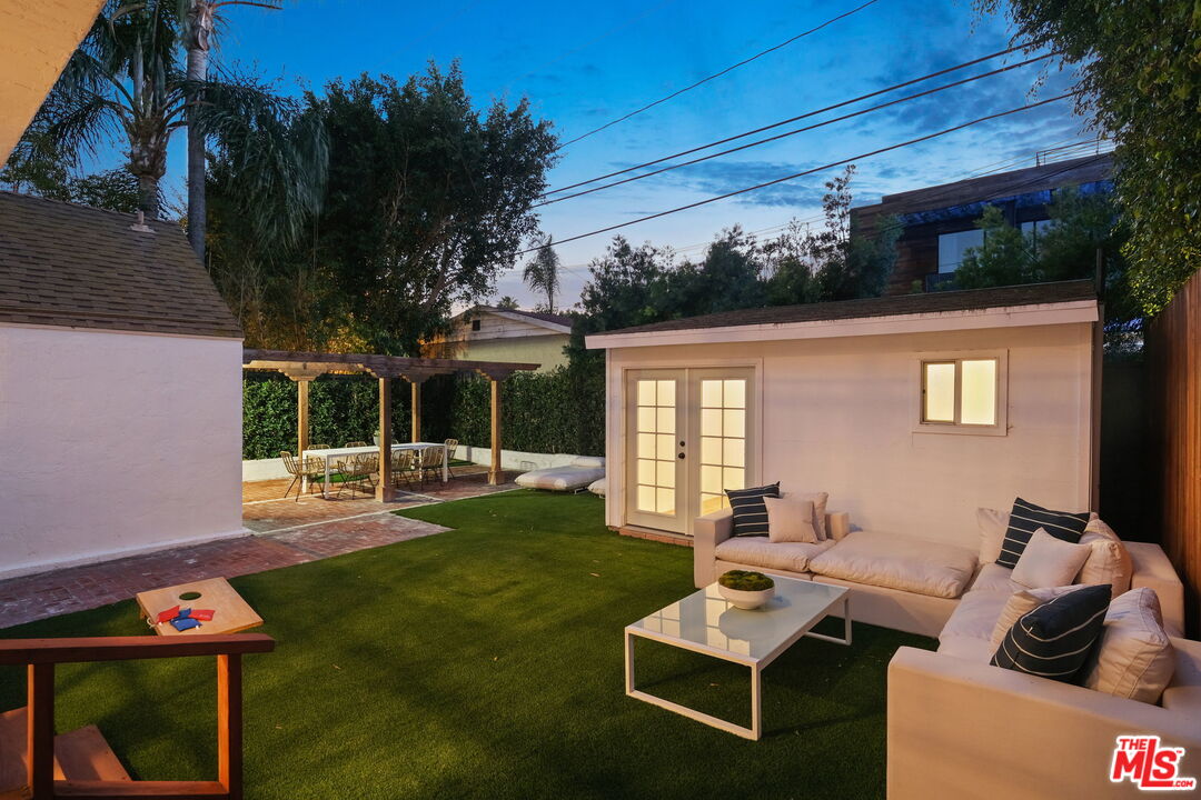 543 Westmount Drive West Hollywood, CA 90048 - Photo 41 of 44 a outdoor living space with furniture potted plant and a large window