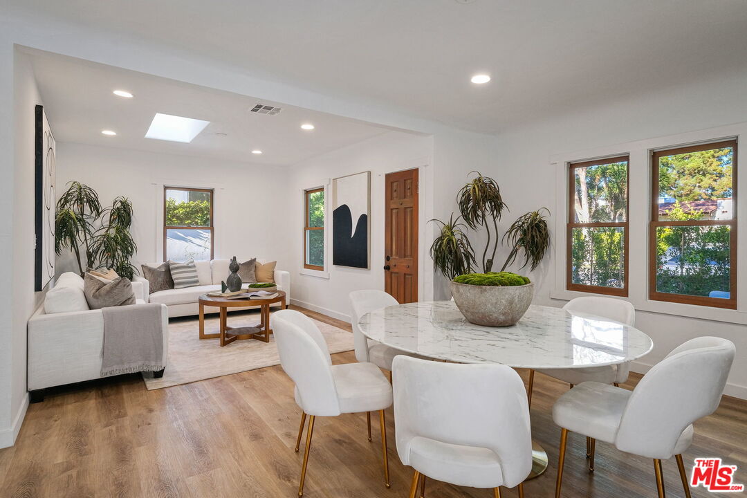 543 Westmount Drive West Hollywood, CA 90048 - Photo 6 of 44 a dining room with furniture and wooden floor