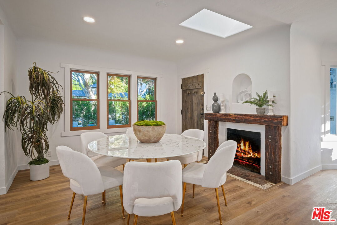 543 Westmount Drive West Hollywood, CA 90048 - Photo 7 of 44 a dining room with furniture window and wooden floor