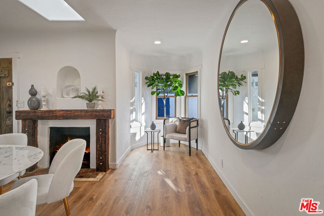 543 Westmount Drive West Hollywood, CA 90048 - Photo 8 of 44 a living room with furniture and a fireplace