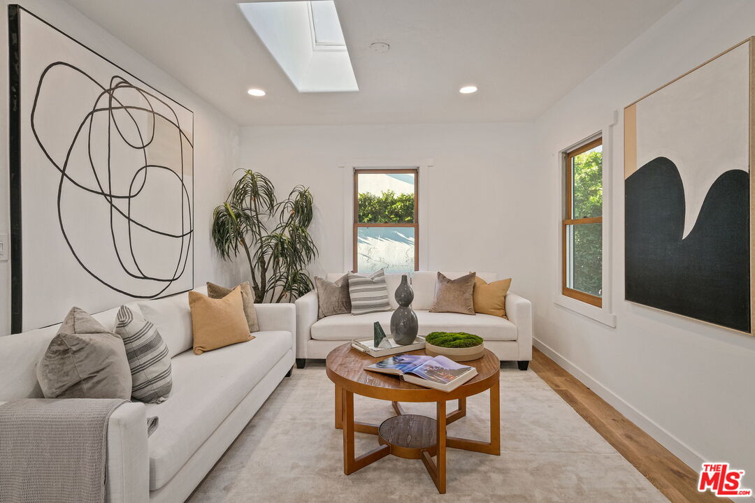 543 Westmount Drive West Hollywood, CA 90048 - Photo 9 of 44 a living room with furniture and a window