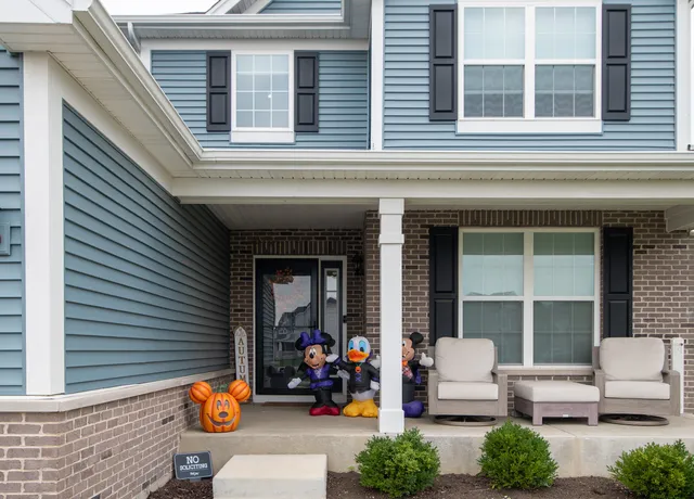 a view of the front of house with outdoor seating